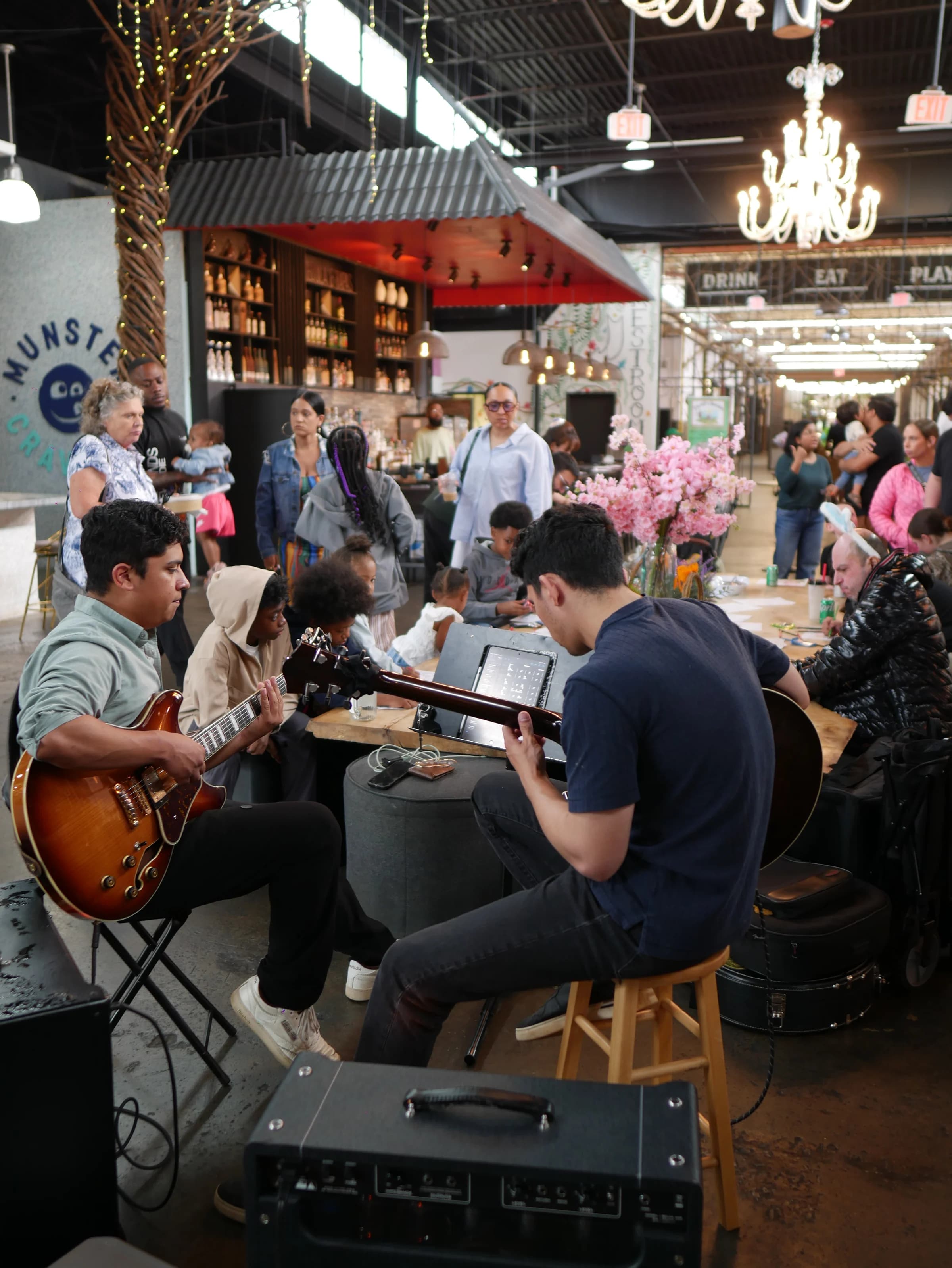 A guitar duo performing inside Chattahoochee Food Works