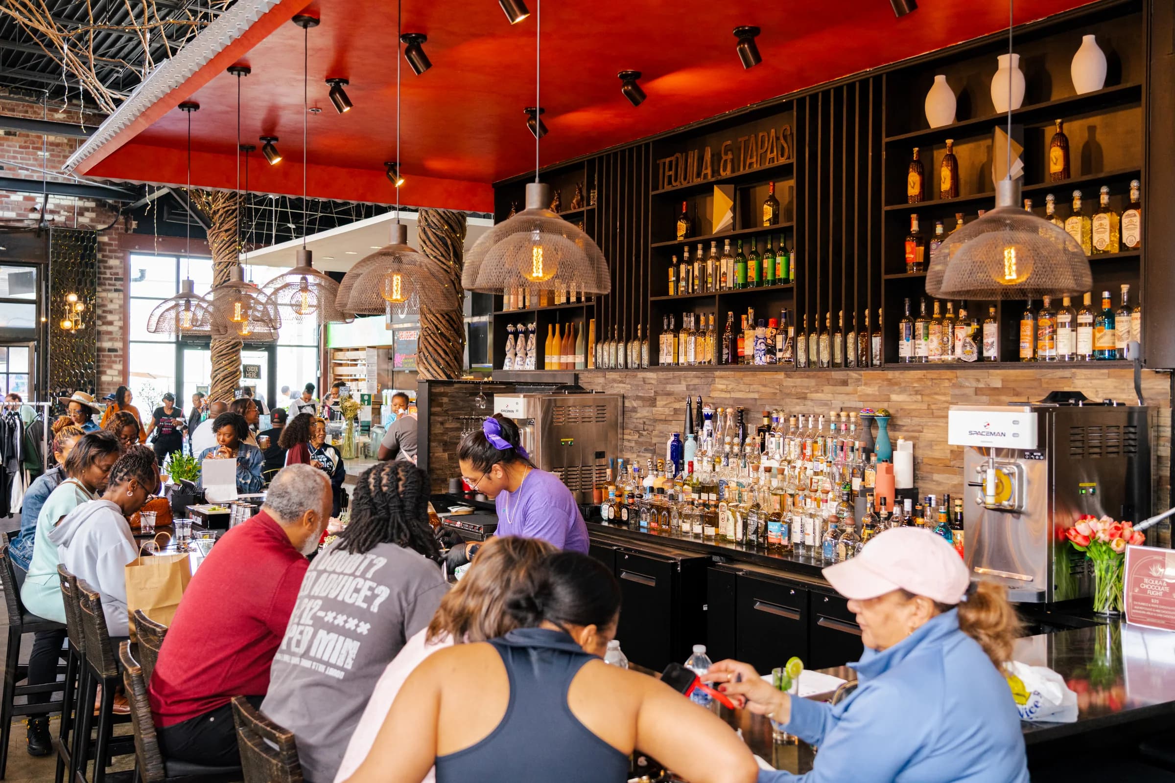 The communal bar during a busy gathering