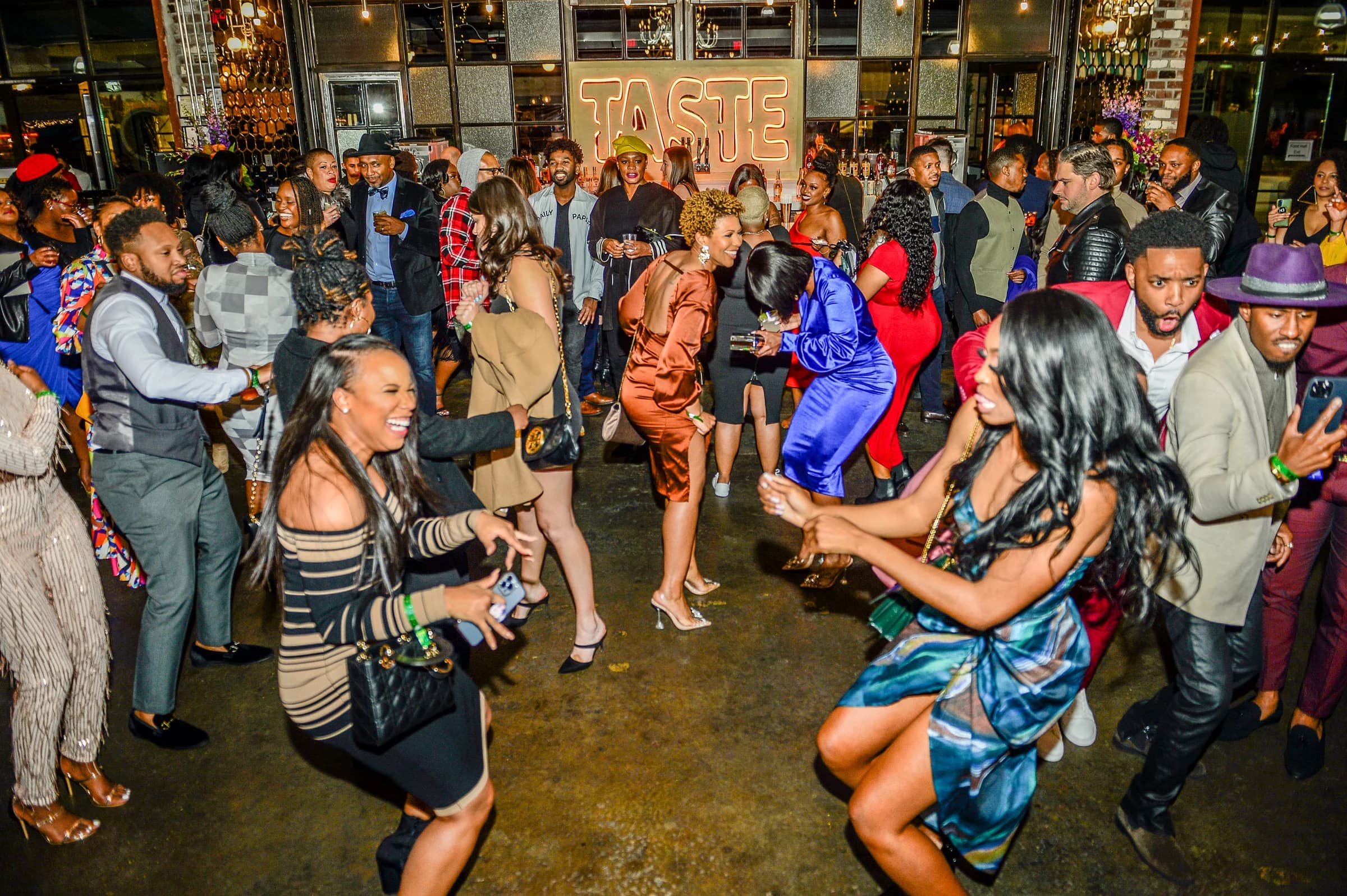 Guests dancing during a packed event inside Chattahoochee Food Works